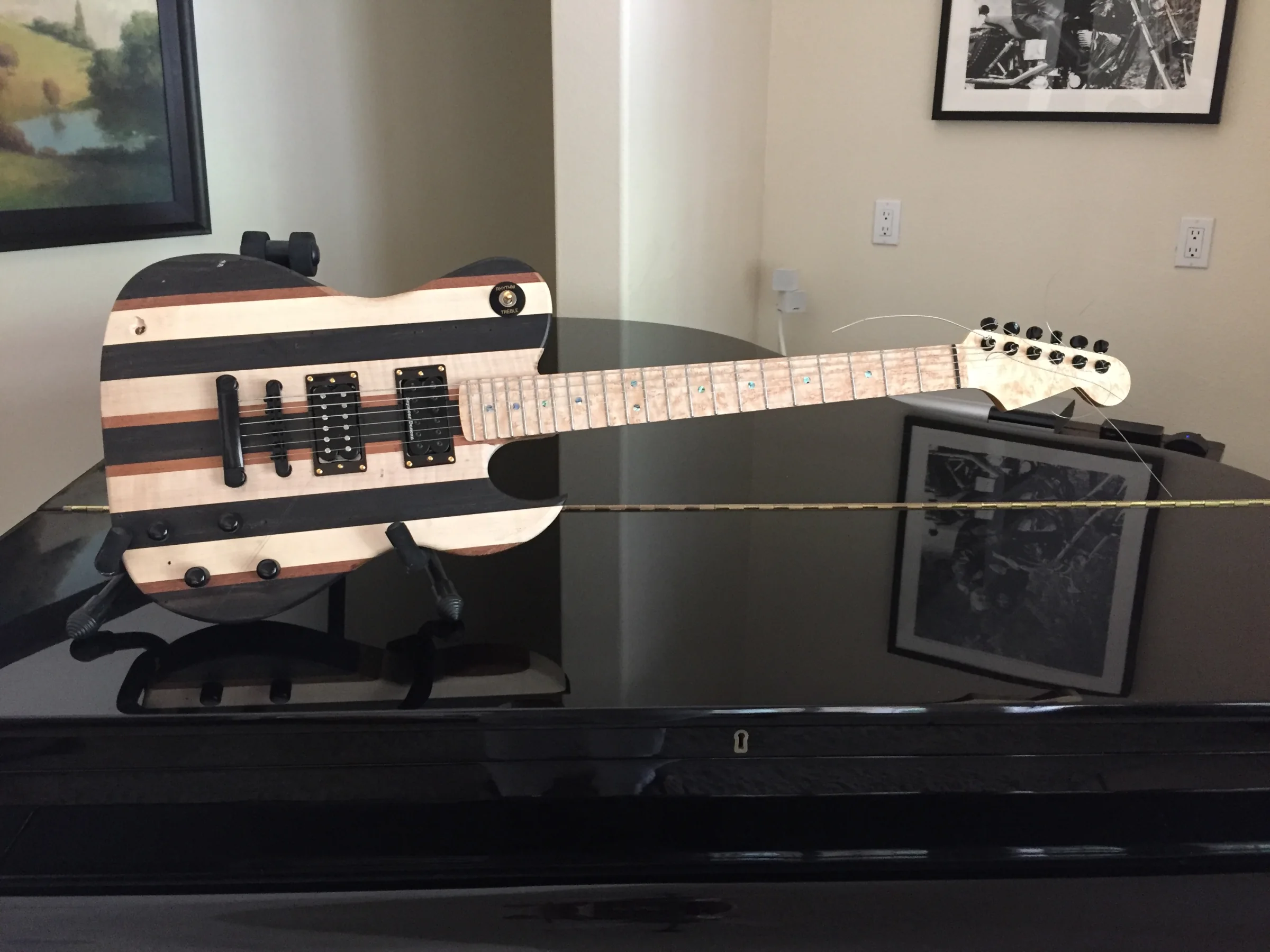 Striped custom SJR guitar displayed horizontally
