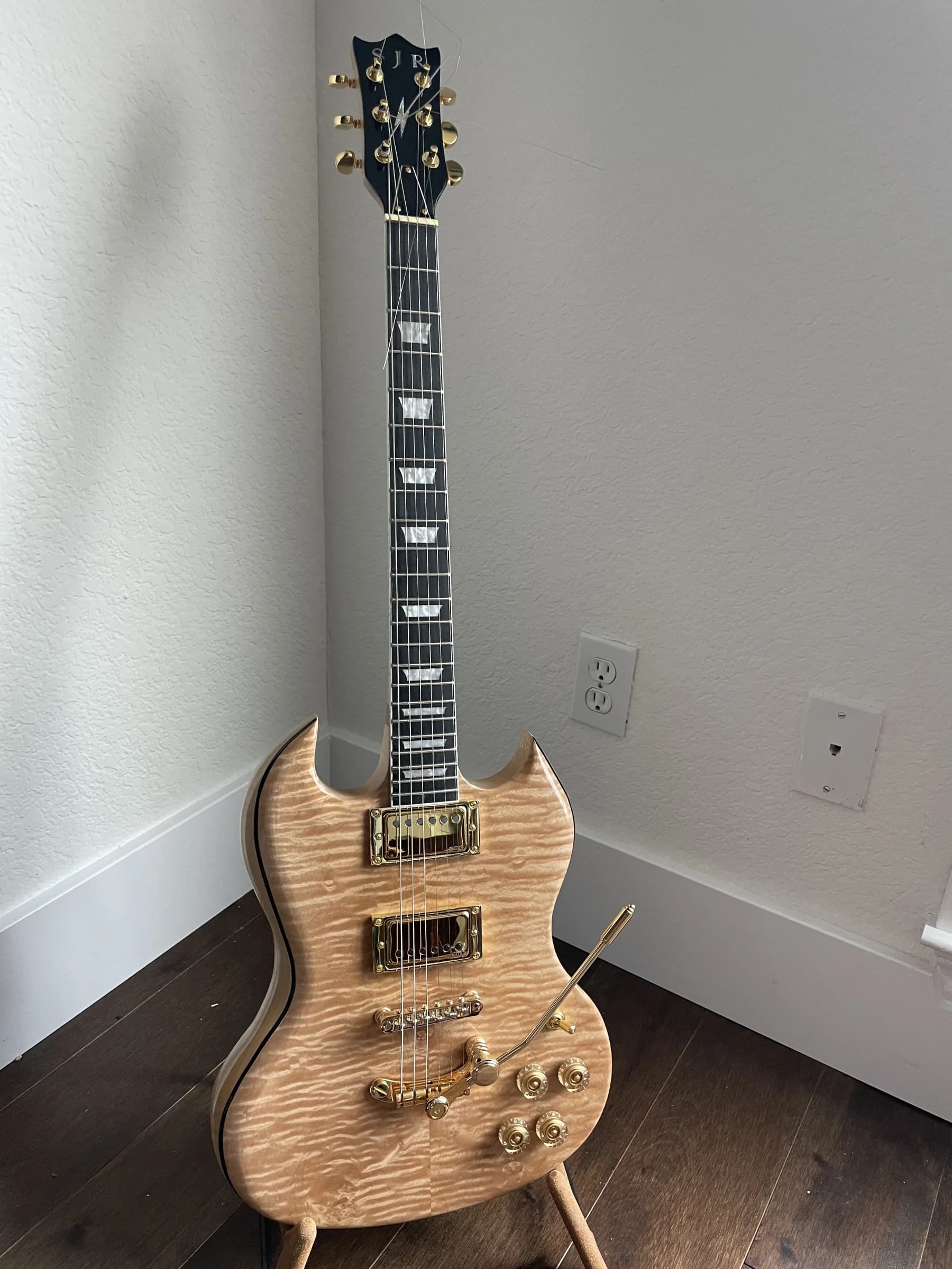 Natural figured double-cut SJR guitar with gold hardware